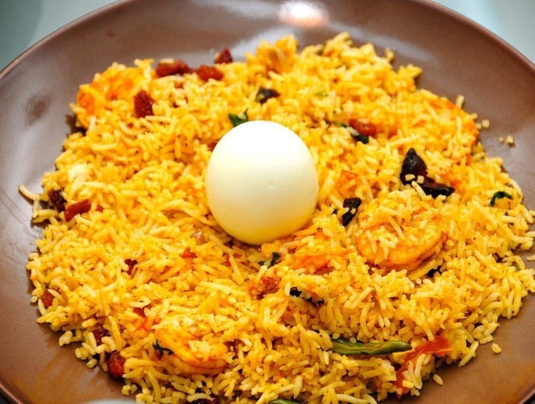 Hyderabadi-style dum biryani served with raita